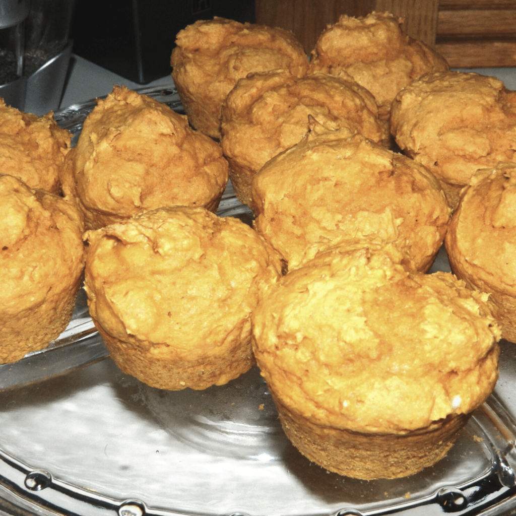 pumpkin cupcakes without frosting on tray